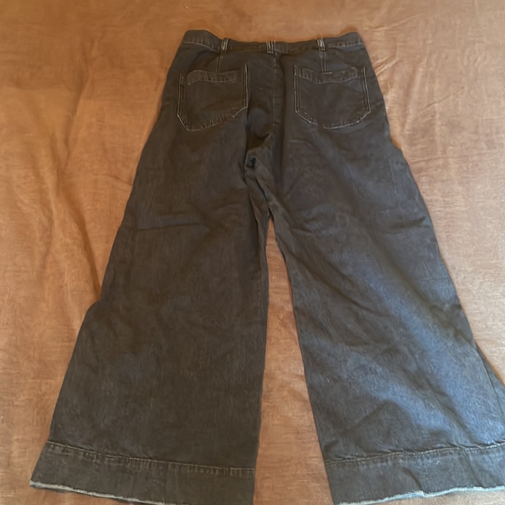 THE GREAT. Wide-Leg Flare Jeans in Black - Picture 2 of 7